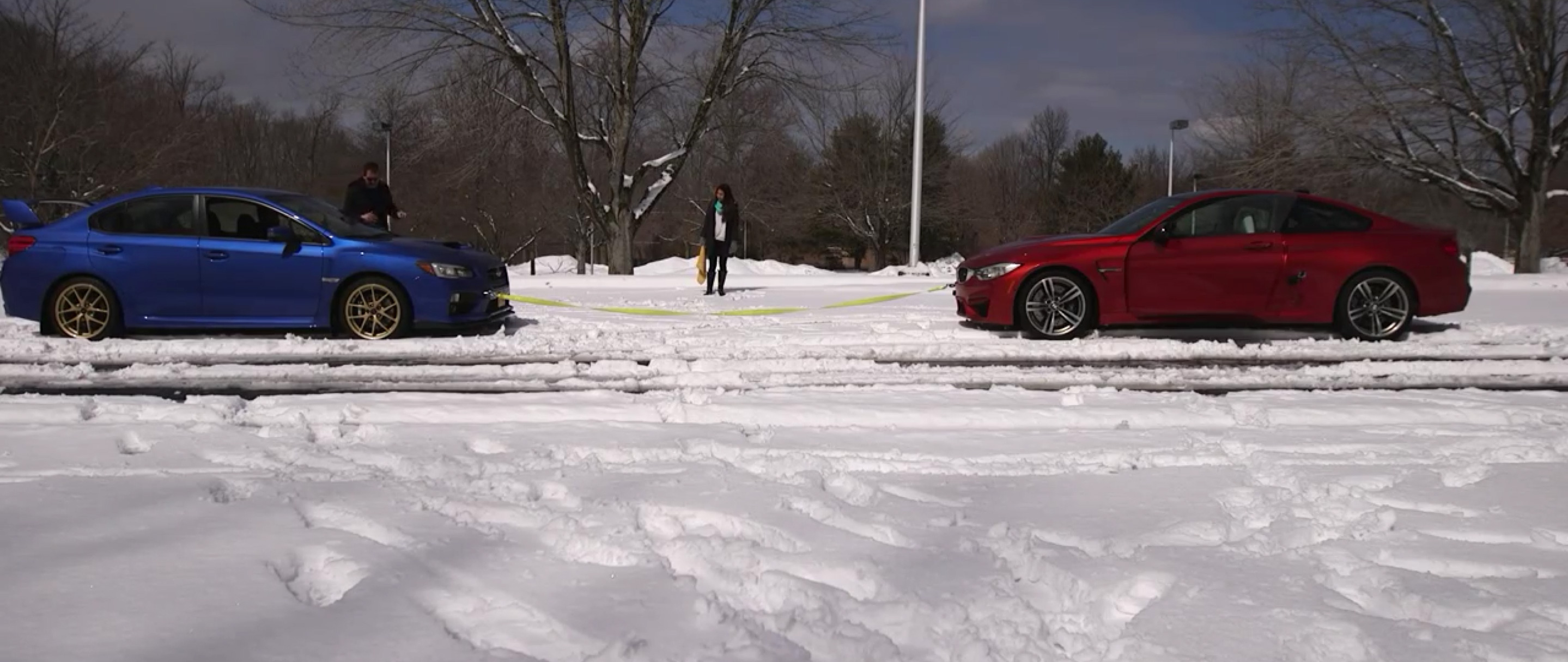 Video: BMW M4 vs. Subaru WRX STI in Snow Towing Session